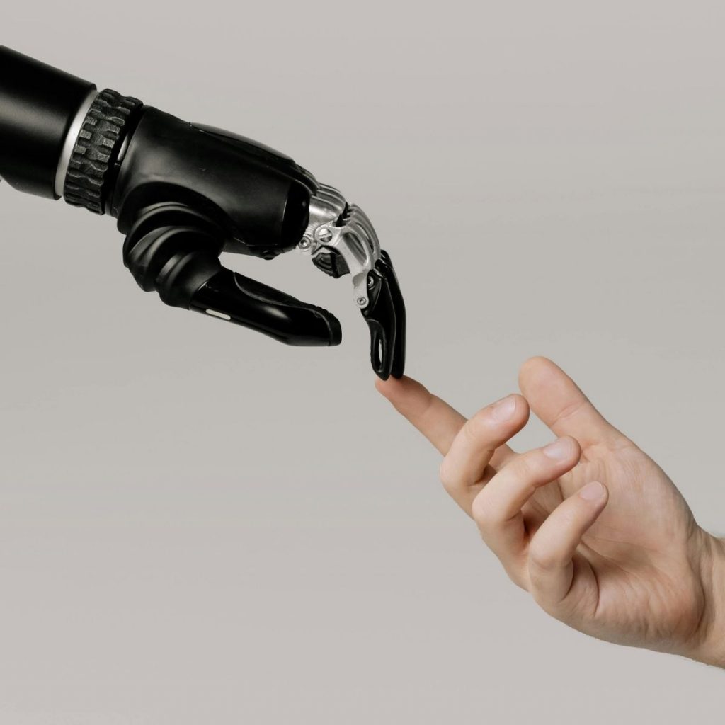 A human and robot hand touches in the center.